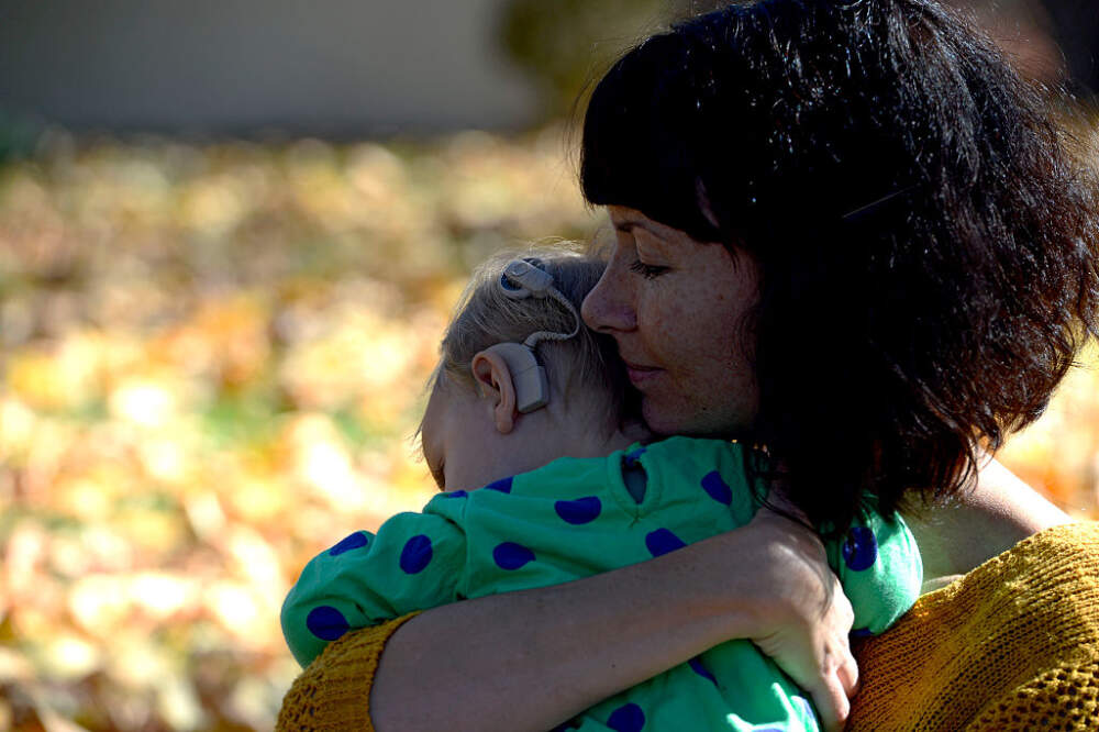 WHEAT RIDGE, CO - OCTOBER 31: Megan Nix share a quiet moment with her daughter Anna Wiedel (16 months) at their home October 313, 2016 in Wheat Ridge. Anna has CMV, a virus contracted in utero that caused her to be born deaf. Nix is writing about how CMV is more prevalent than anyone knows, and how doctors are not warning pregnant mothers. (Photo By John Leyba/The Denver Post via Getty Images)