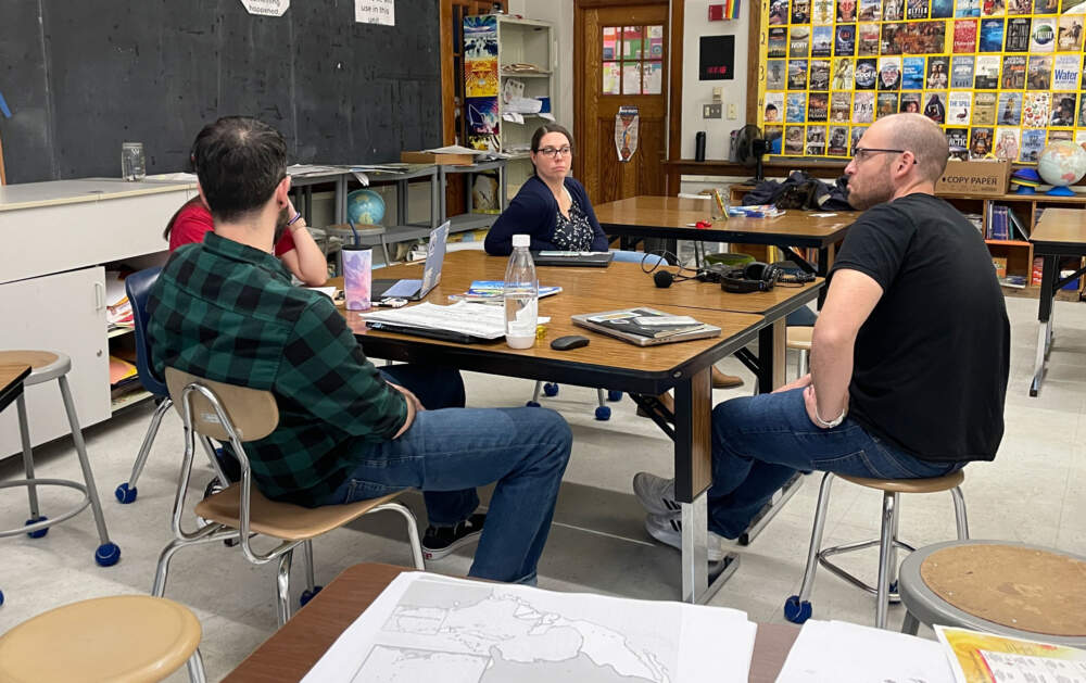 Educators at the Stacy Middle School in Milford meet to discuss performance assessments, including Dan Cote, right, and Alissa Holland, center. (Max Larkin/WBUR)