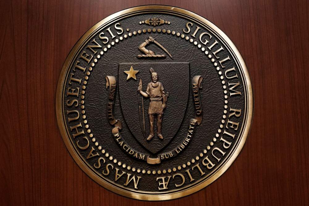 The seal of the commonwealth of Massachusetts, featuring a Native American at center, is displayed on a medallion inside an elevator at the State House, in Boston. (Charles Krupa/AP)