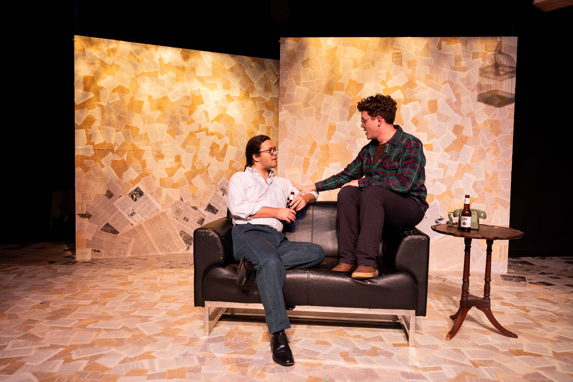 Chingwe Padraig Sullivan and Dylan C. Wack talk on the couch. (Courtesy Niles Scott Studios)