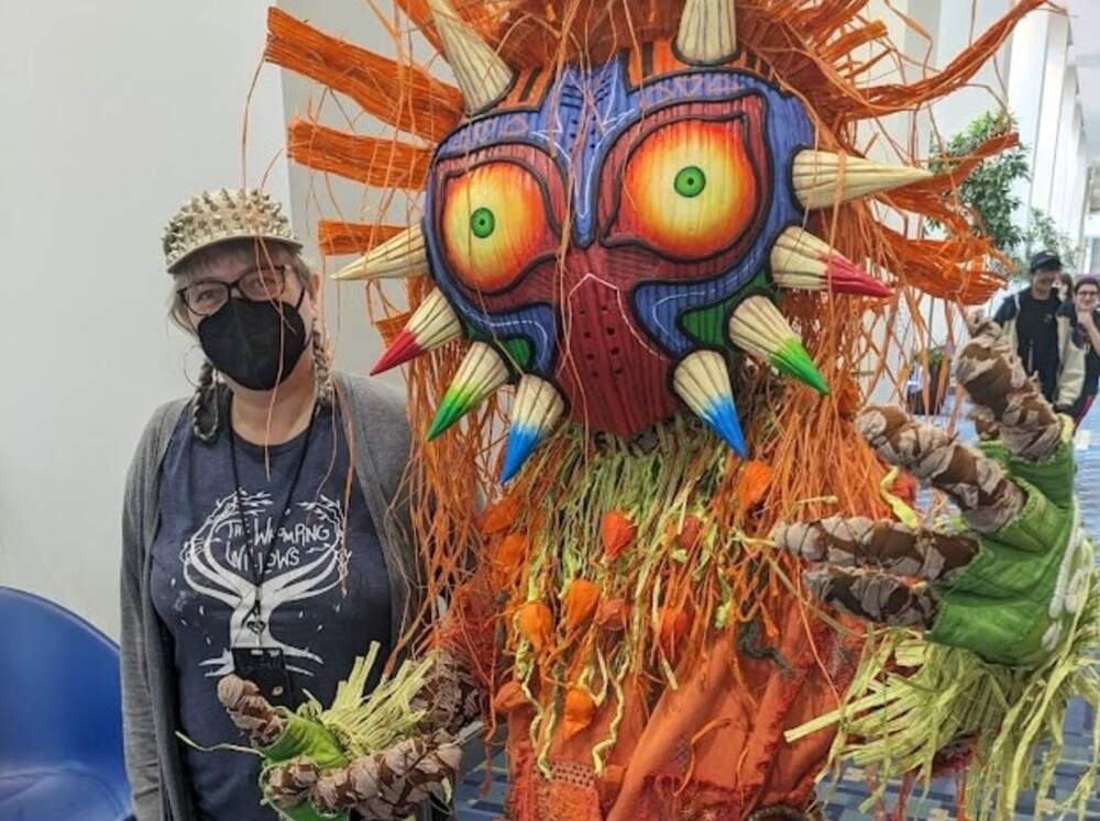 Sandra Thomas (right) designed this Skull Kid costume from &quot;The Legend of Zelda: Majora's Mask&quot; for her son, Ezra Thomas, who won Best in Show at the Awesome Con cosplay contest. (James Perkins Mastromarino/Here & Now)