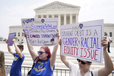 People demonstrate outside the Supreme Court on Friday in Washington. (Jacquelyn Martin/AP)