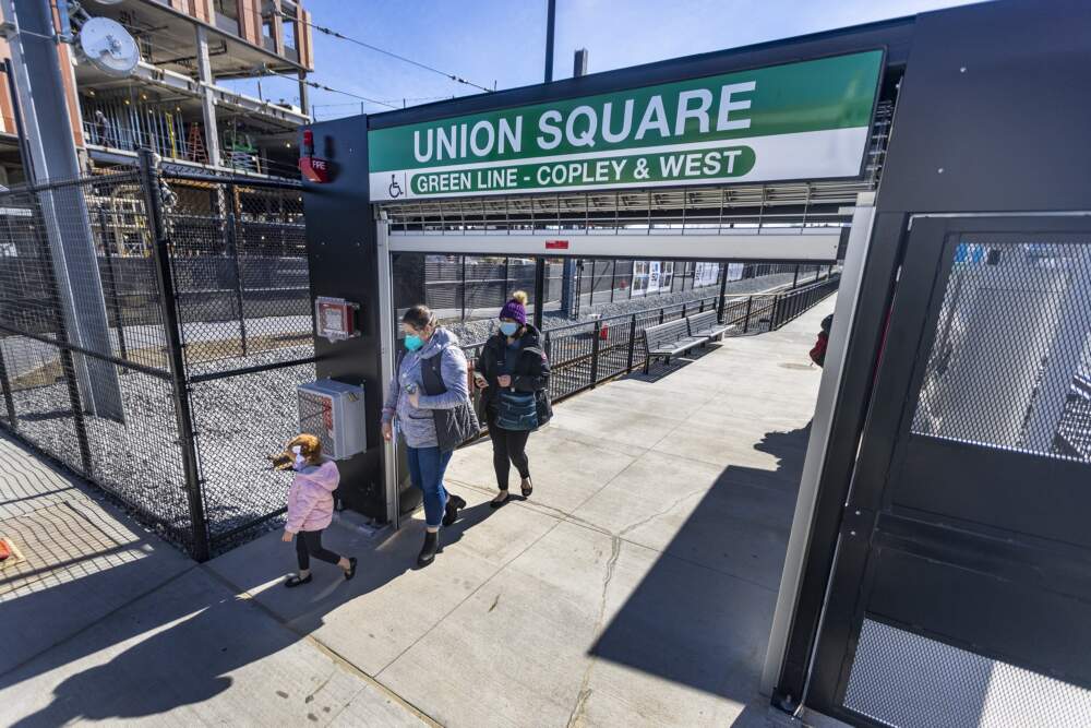 Riders walk through the entrance of the MBTA's Union Square Station. (Jesse Costa/WBUR)