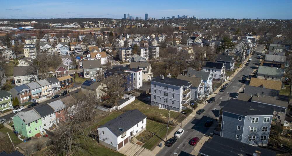 Houses and apartments seen from Ballou Avenue in Mattapan, looking out toward downtown Boston. (Robin Lubbock/WBUR)
