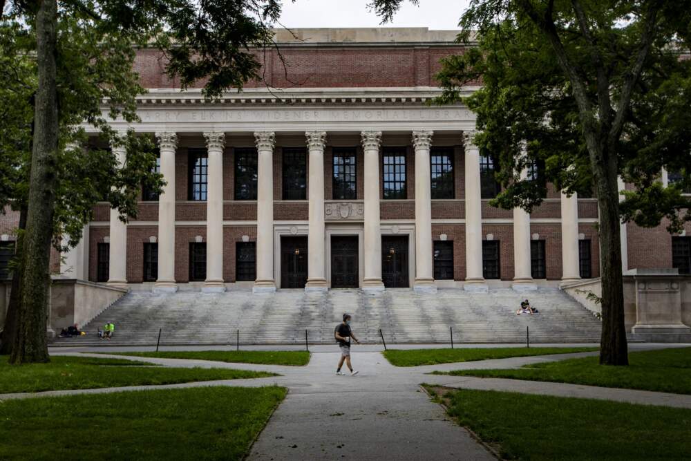 A man walks past the front entrance of the Widener Library in Harvard Yard. (Jesse Costa/WBUR)