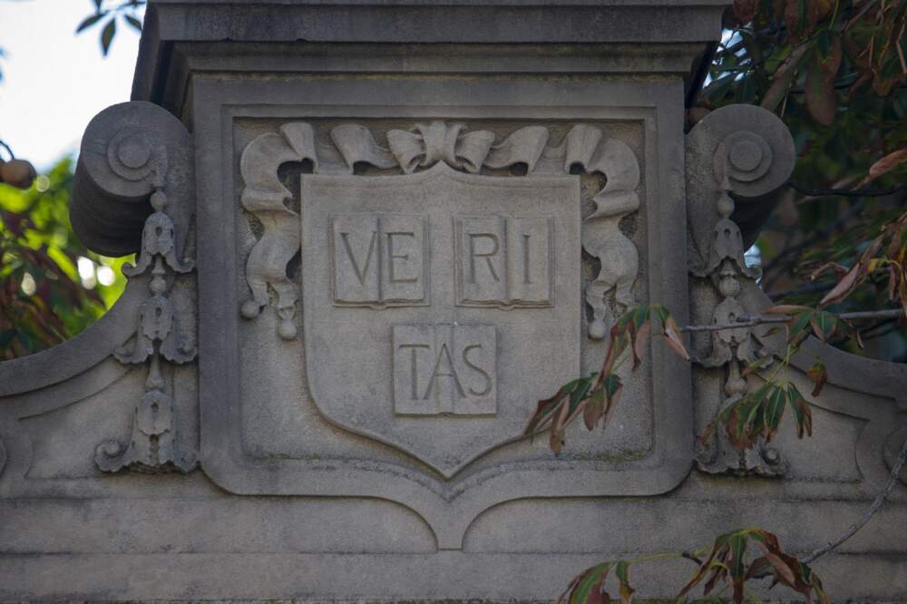 The Harvard Veritas coat of arms on one of the gates at Harvard Yard. (Jesse Costa/WBUR)