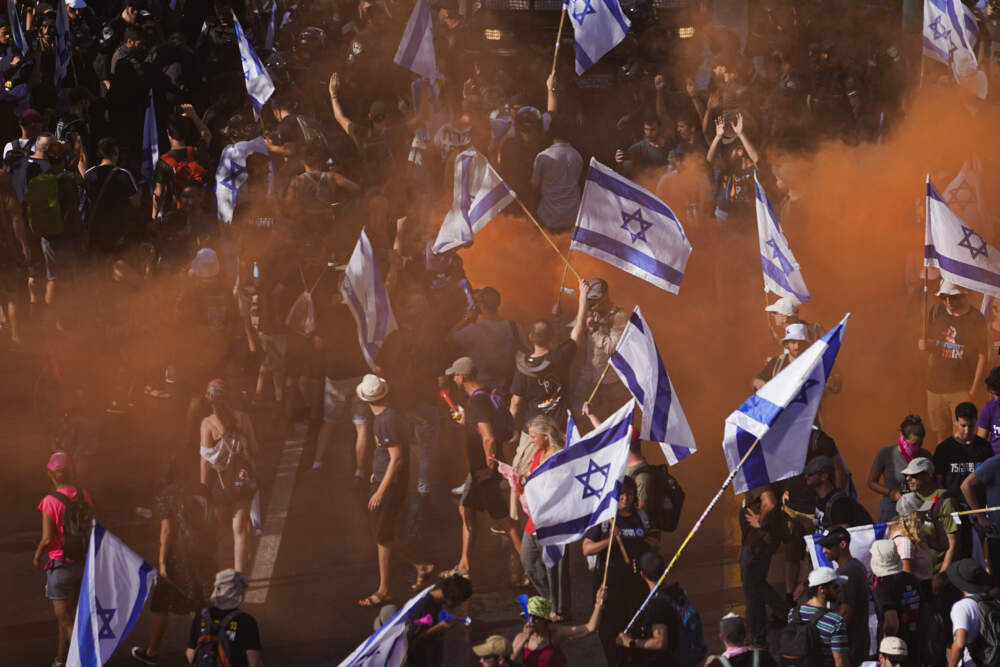 Demonstrators in Jerusalem block a road during a protest against plans by Prime Minister Benjamin Netanyahu's government to overhaul the judicial system. (Ariel Schalit/AP)