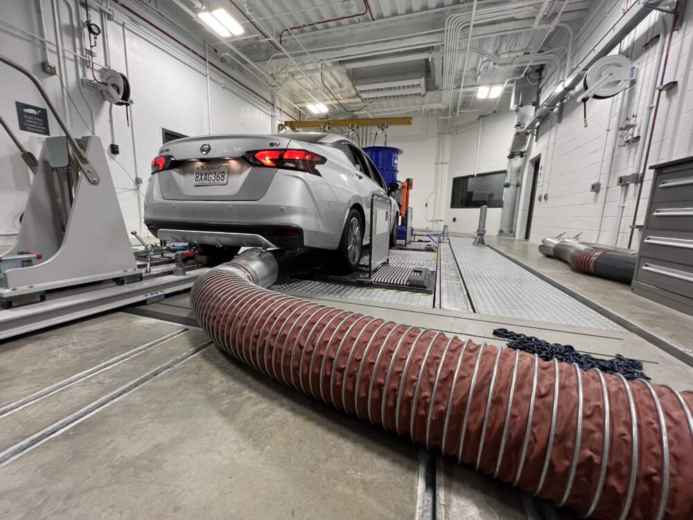 A car has its tailpipe pollutants collected and analyzed at California's new emissions testing laboratory. (Photo: Saul Gonzalez/KQED)