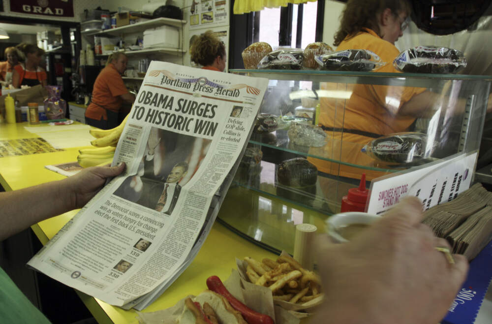 Donald Walsh, of Lewiston reads the Portland Press Herald reporting the results of the 2008 presidential election while eating lunch at a diner in Lewiston, Maine, on November 5, 2008. (Pat Wellenbach/AP)