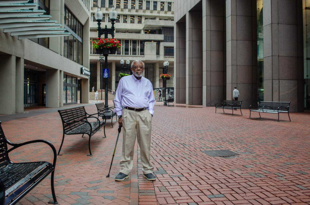 Civil rights activist Ted Landsmark stands outside Boston City Hall in the spot where anti-busing demonstrators attacked him in 1976. (Sharon Brody/WBUR)