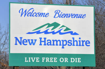 The welcome sign on the Massachusetts state border with New Hampshire. (Joseph Prezioso/AFP via Getty Images)