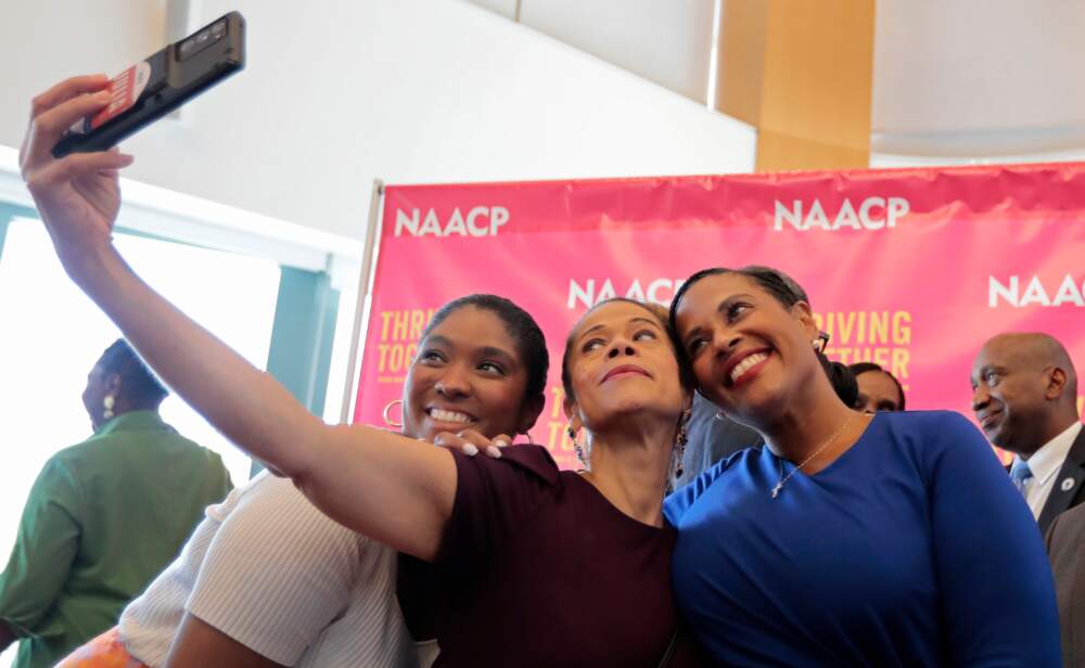 Boston City Councilor At-Large Julia Mejia, center, takes a selfie with Councilor Kendra Lara, left, and NAACP Branch president Tanisha Sullivan.  (Pat Greenhouse/The Boston Globe via Getty Images)