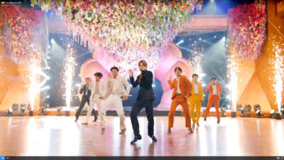 In this screengrab (from left to right), RM, V, Jungkook, Jimin, J-Hope, Suga and Jin of BTS perform onstage during the 63rd Annual Grammy Awards broadcast on March 14, 2021. (Theo Wargo/Getty Images for The Recording Academy)