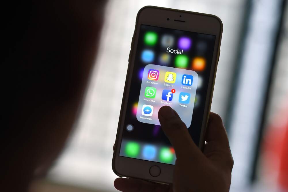 A report describes how social media platforms make it difficult for users to report dangerous online abuses. (Manan Vatsyayana/AFP via Getty Images)