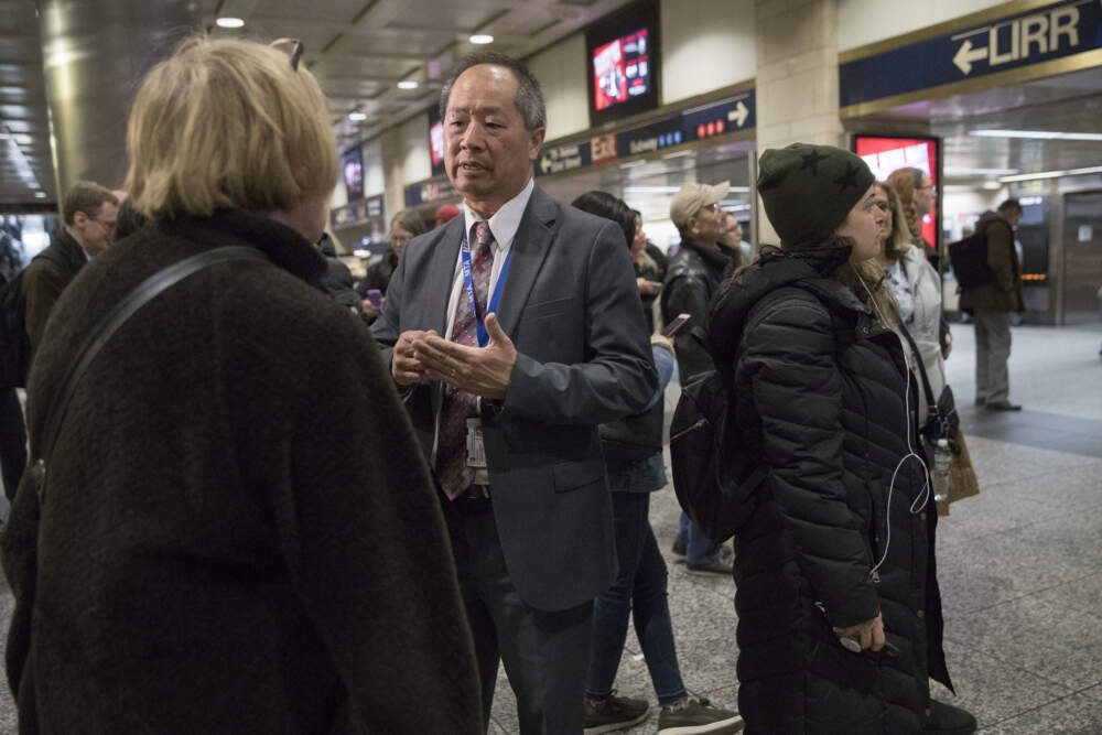 MBTA General Manager Phillip Eng, center, when he was Long Island Rail Road's president, talks to evening rush hour commuters at Penn Station, Tuesday, April 17, 2018, in New York. (Mary Altaffer/AP)