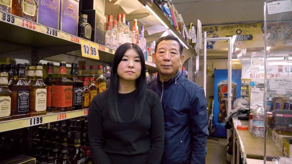 So Yun Um and her dad, Hae Sup Um at their liquor store. (Jacki Huntington)