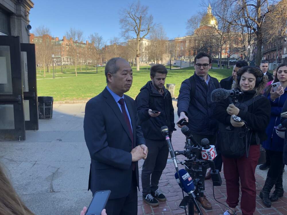 MBTA General Manager Phillip Eng talks with reporters outside Boylston station. (WBUR)