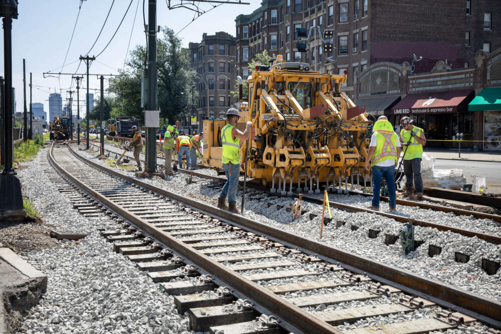 MBTA workers replace track on the Green Line at Packards Corner. (Robin Lubbock/WBUR)