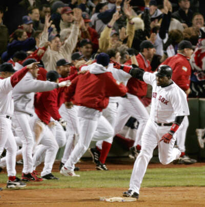 Boston Red Sox's David Ortiz celebrates as he rounds first base after hitting a game-winning home run in the 12th inning against the New York Yankees, of Game 4 of the AL championship series, Sunday night, Oct. 17, 2004, at Boston's Fenway Park. The Yankees lead series, 3-1. (Amy Sancetta/AP)