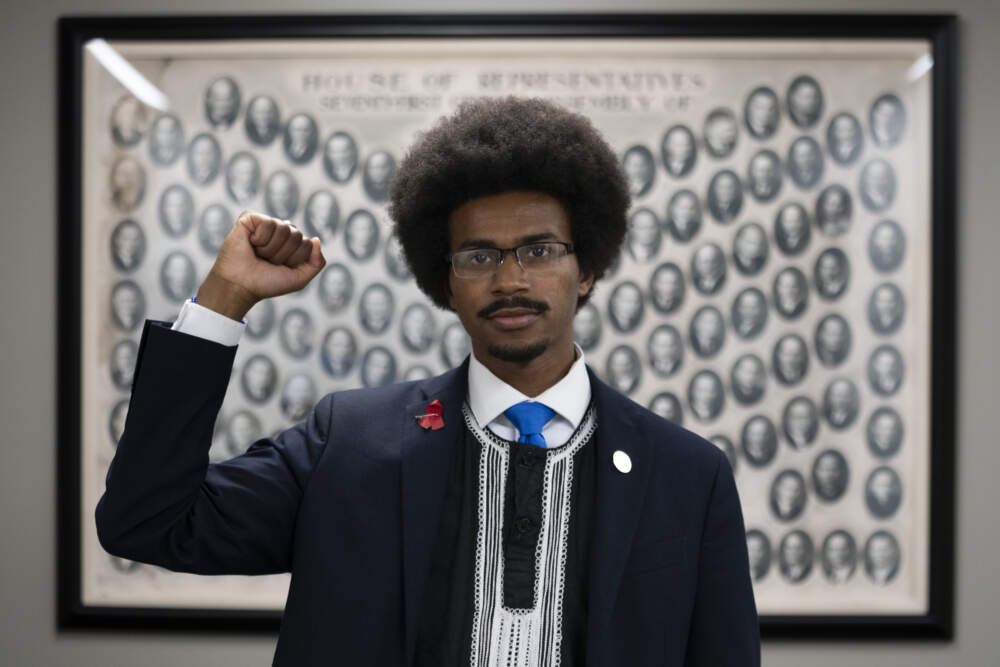 State Rep. Justin Pearson, D-Memphis, poses for a portrait in front of a 1930s Tennessee House of Representatives composite in a hallway outside his office at the Cordell Hull Building, Monday, April 17, 2023, in Nashville, Tenn. (George Walker IV/AP)