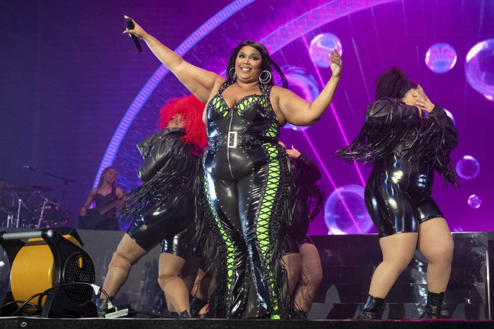 Lizzo performs at the BottleRock Napa Valley Music Festival on May 27, 2023, in Napa, Calif. Lizzo has been sued by three former dancers who accuse the Grammy winner of sexual harassment and allege the singer and her production company created a hostile work environment. (Amy Harris/Invision/AP)