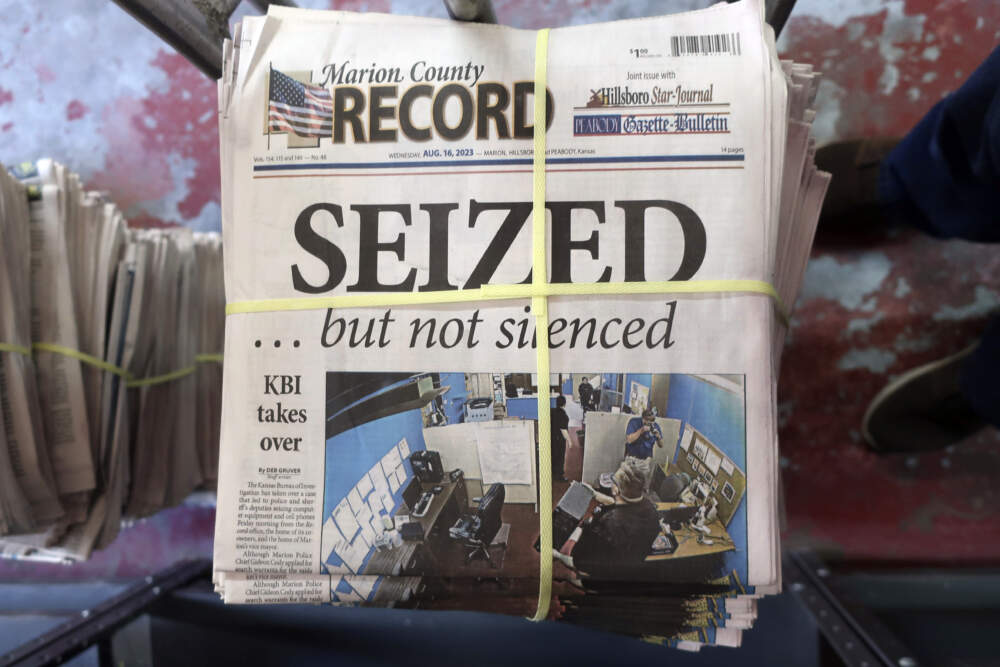 A stack of the latest weekly edition of the Marion County Record sits in the back of the newspaper's building, awaiting unbundling, sorting and distribution. (John Hanna/AP)