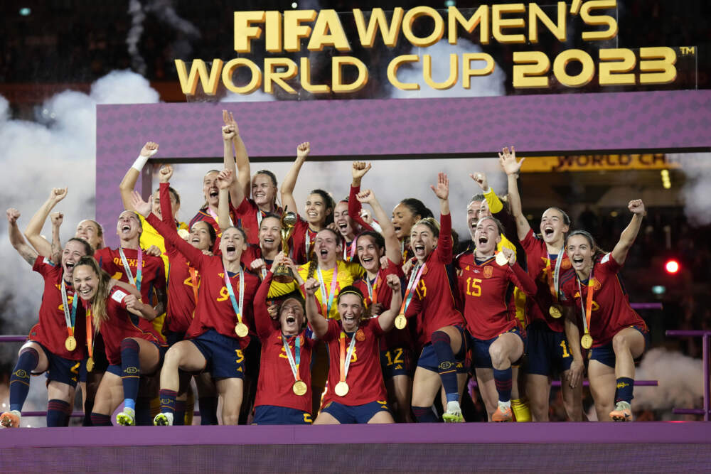 Team Spain celebrates with the trophy after winning the Women's World Cup soccer final against England at Stadium Australia in Sydney, Australia. (Alessandra Tarantino/AP)