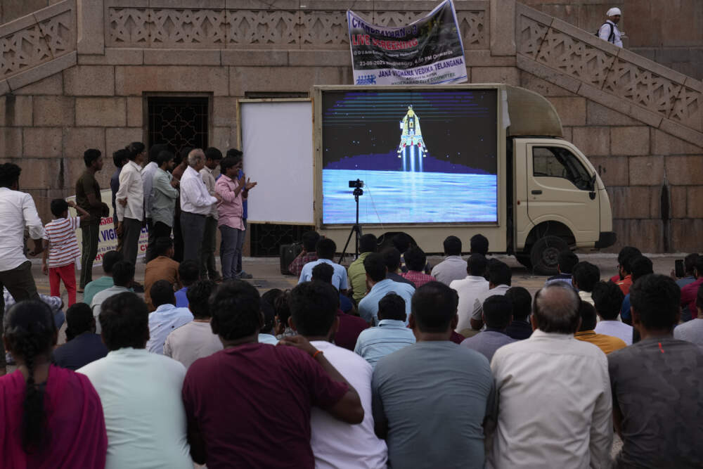 People watch the landing of Chandrayaan-3, or &quot;moon craft&quot; at Omani University in Hyderabad, India. (Mahesh Kumar A./AP)