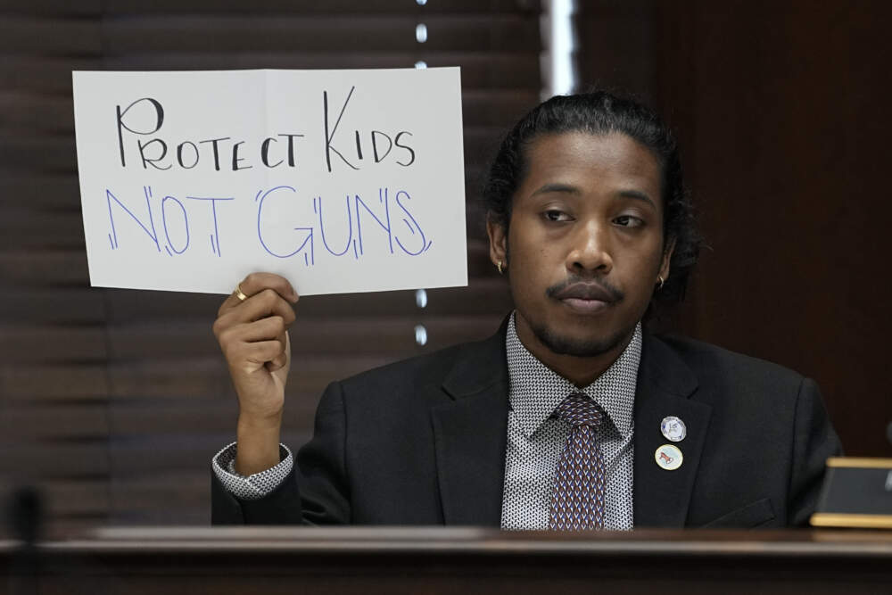 Rep. Justin Jones, D-Nashville, holds a sign in the House Civic Justice Committee of 1st Extraordinary Session meeting during a special session of the state legislature on public safety. (George Walker IV/AP)