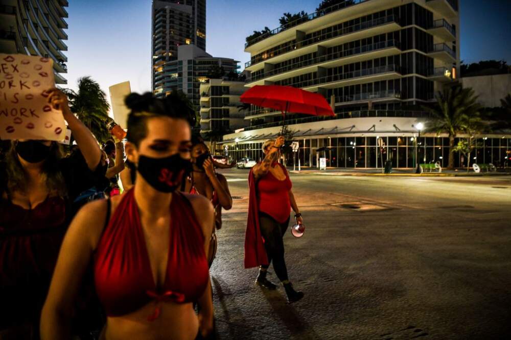 Activists and sex workers march in the streets of Miami Beach for the decriminalization of sex work on December 5, 2020. (Photo by CHANDAN KHANNA/AFP via Getty Images)