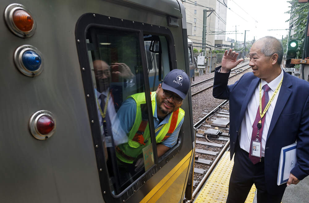 MBTA General Manager Phil Eng chats with a Blue Line operator. (Lane Turner/The Boston Globe via Getty Images)