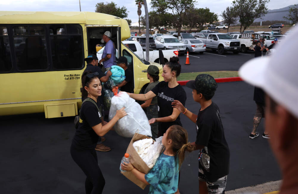Volunteers with King's Cathedral Maui unload donations of blankets and supplies on Aug. 10, 2023 in Kahului, Hawaii. (Justin Sullivan/Getty Images)