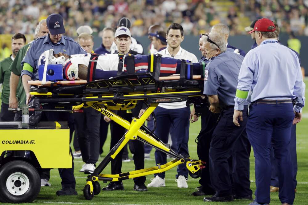 New England Patriots cornerback Isaiah Bolden is brought off the field after being injured during the second half of a preseason NFL football game against the Green Bay Packers, Saturday, Aug. 19, 2023, in Green Bay, Wis. The game was suspended after the injury. (Matt Ludtke/AP)