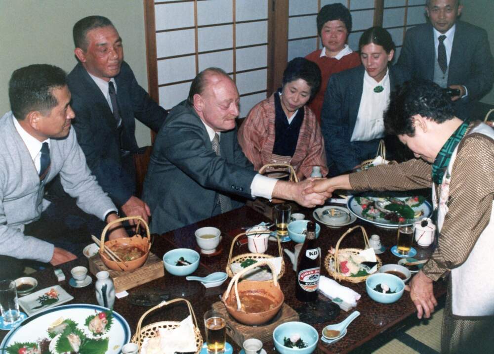  Filmmaker Herbert Sussan at a dinner in Japan with hibakusha, survivors of the atomic attacks. (Courtesy of Leslie Sussan)