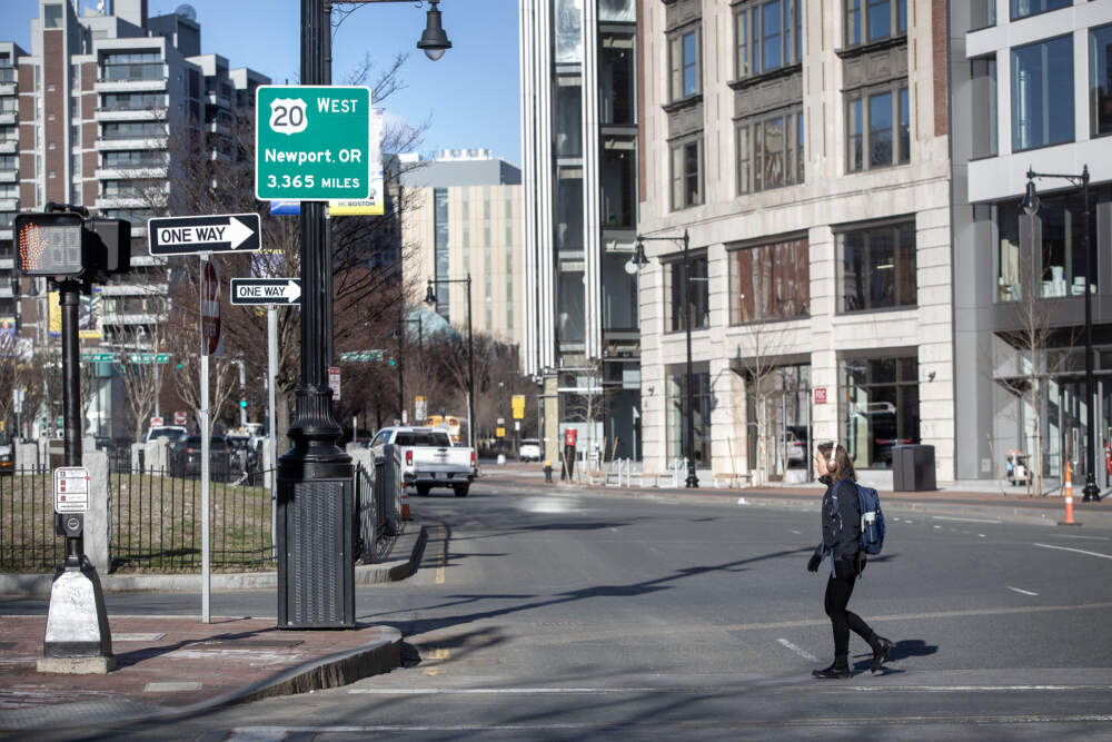 A sign in Boston's Kenmore Square tells visitors they can follow Route 20 west for 3,365 miles, all the way to Newport, Oregon. (Robin Lubbock/WBUR)