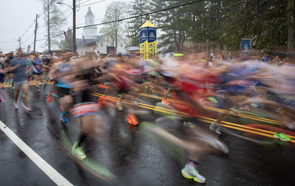 Runners cross the starting line of the 127th Boston Marathon. (Robin Lubbock/WBUR)