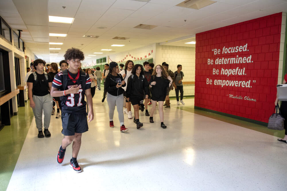 Salem High School students walk through the halls at the end of a day of phone free classes. (Robin Lubbock/WBUR)
