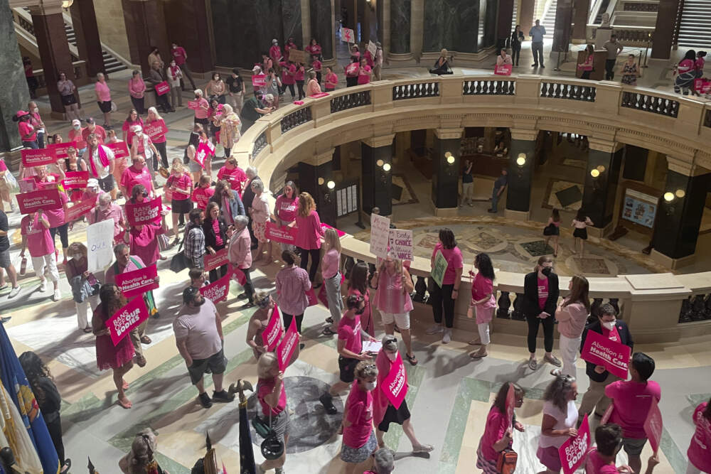 Abortion rights supporters gather for a &quot;pink out&quot; protest organized by Planned Parenthood in the rotunda of the Wisconsin Capitol, June 22, 2022, in Madison, Wis. Wisconsin. (Harm Venhuizen/AP)