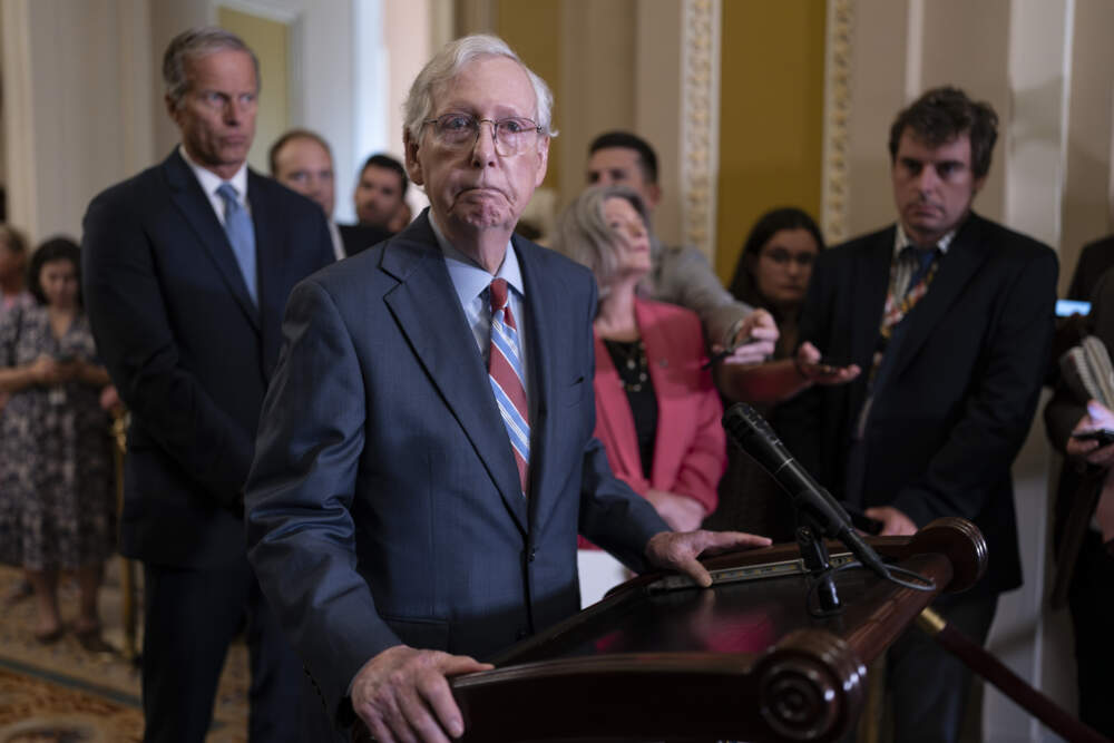 Senate Minority Leader Mitch McConnell returns to his press conference after he froze at the microphones and became disoriented. (Scott Applewhite/AP)