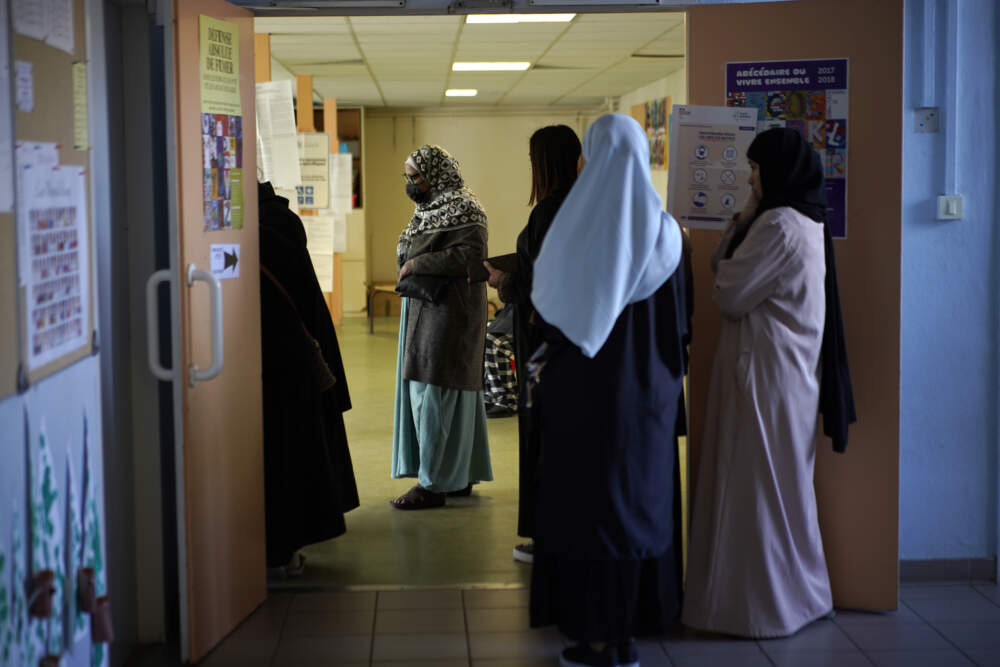 France's education minister announced that long robes in classrooms would be banned starting with the new school year, saying that secularism in the nation's schools is being &quot;tested&quot; via the garments, worn mainly by Muslims. (Daniel Cole/AP)