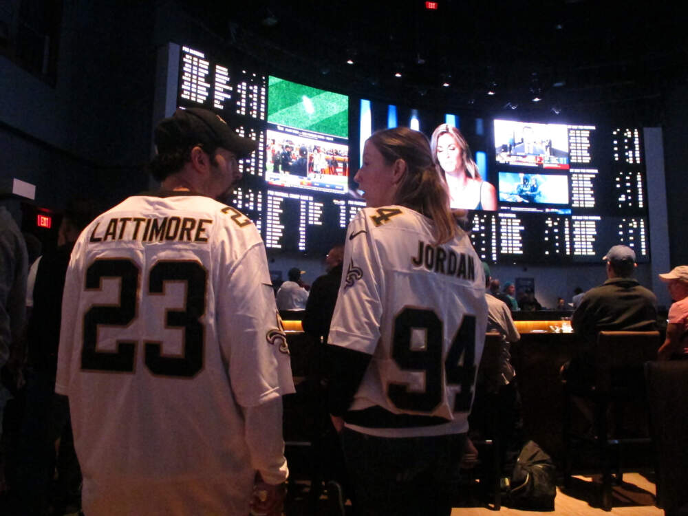 Football fans wait for kickoff in the sports betting lounge at the Ocean Casino Resort in Atlantic City, N.J., Sept. 9, 2018. When the NFL season kicks off this week, Kentucky residents and visitors — for the first time — will be able to legally place sports bets on something other than horse racing, When they do, they also will be funding the state's first-ever program for people with gambling problems. (Wayne Parry/AP)