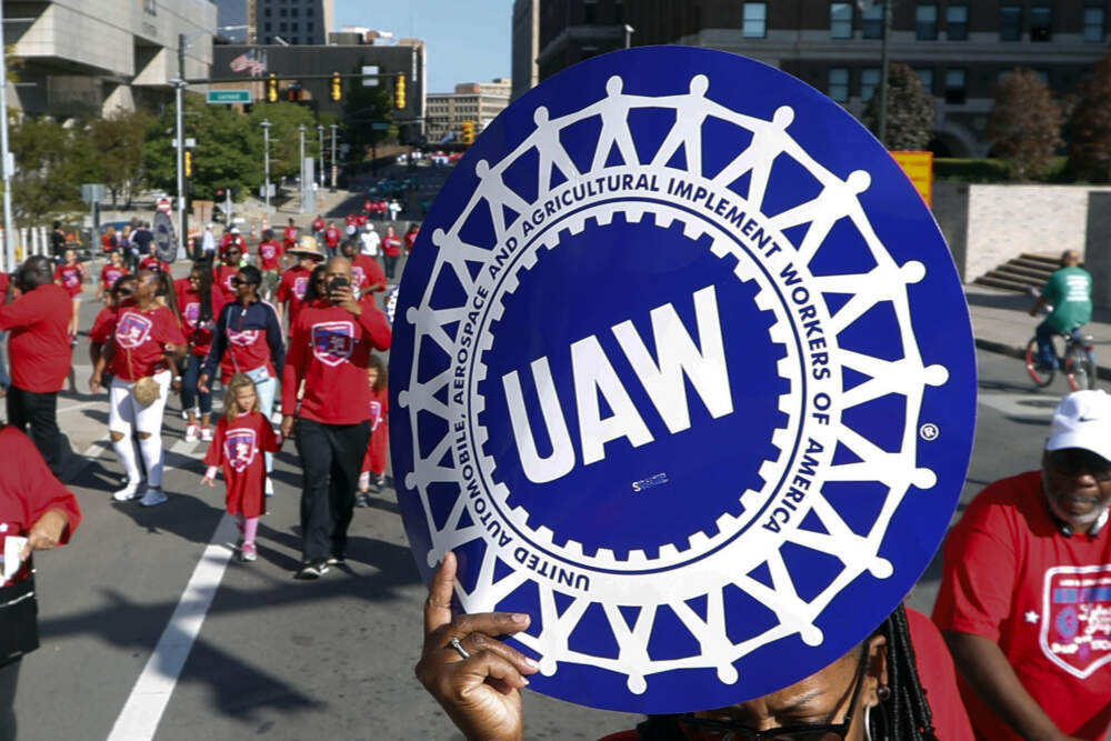 United Auto Workers members walk in the Labor Day parade in Detroit, Sept. 2, 2019. (Paul Sancya/AP)