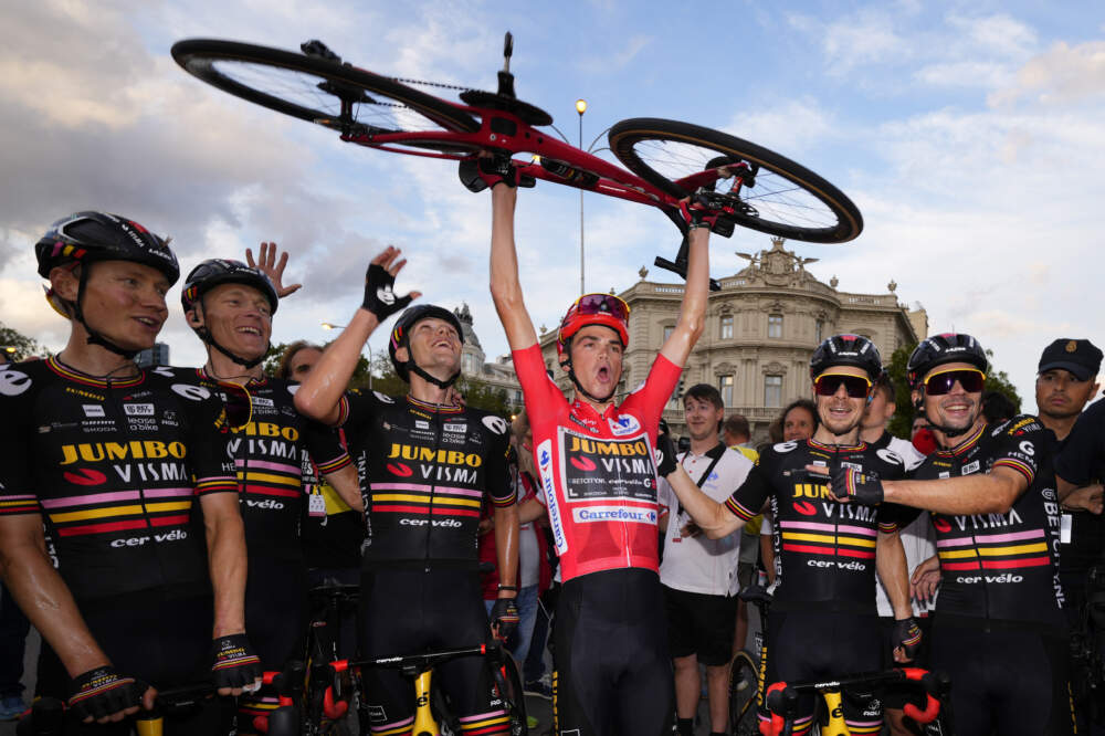 Sepp Kuss of Jumbo-Visma (center) celebrates after winning the Vuelta cycling race in Madrid, Spain. (Manu Fernandez/AP)