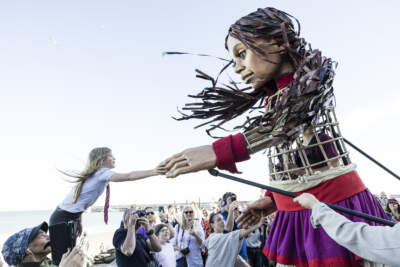 Little Amal, a 12-foot puppet of a Syrian refugee child, travels across the U.S. to raise awareness about the plight of refugees across the world. (Courtesy The Walk Productions/Igor Emerich)