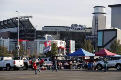 People tailgate outside Gillette Stadium before an NFL football game between the New England Patriots and the Miami Dolphins, Sunday, Sept. 16, 2023, in Foxborough, Mass. (Michael Dwyer/AP)