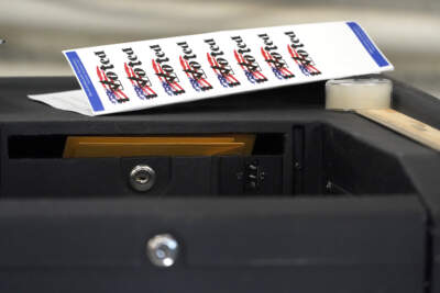 &quot;I voted&quot; stickers lay on top of a ballot machine inside Haverhill City Hall in Haverhill, Mass. in 2020. (Elise Amendola/AP)