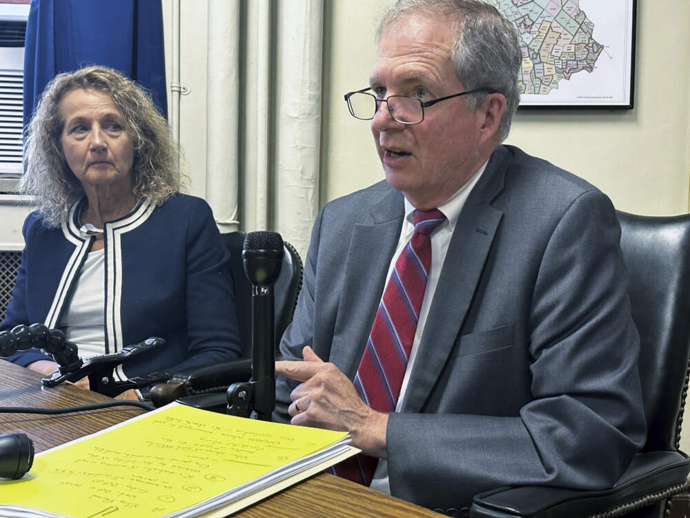 New Hampshire Deputy Secretary of State Patricia Lovejoy, left, looks on as Secretary of State David Scanlan explains that he will not use an amendment to the U.S. Constitution to block former President Donald Trump from the ballot in the state that will hold the first Republican presidential primary next year, at the Statehouse, in Concord, N.H., Wednesday, Sept. 13, 2023. (Holly Ramer/AP)