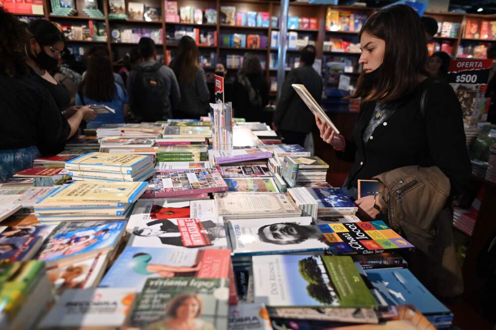 A woman reads a book in Buenos Aires. (Luis Robayo/AFP via Getty Images)