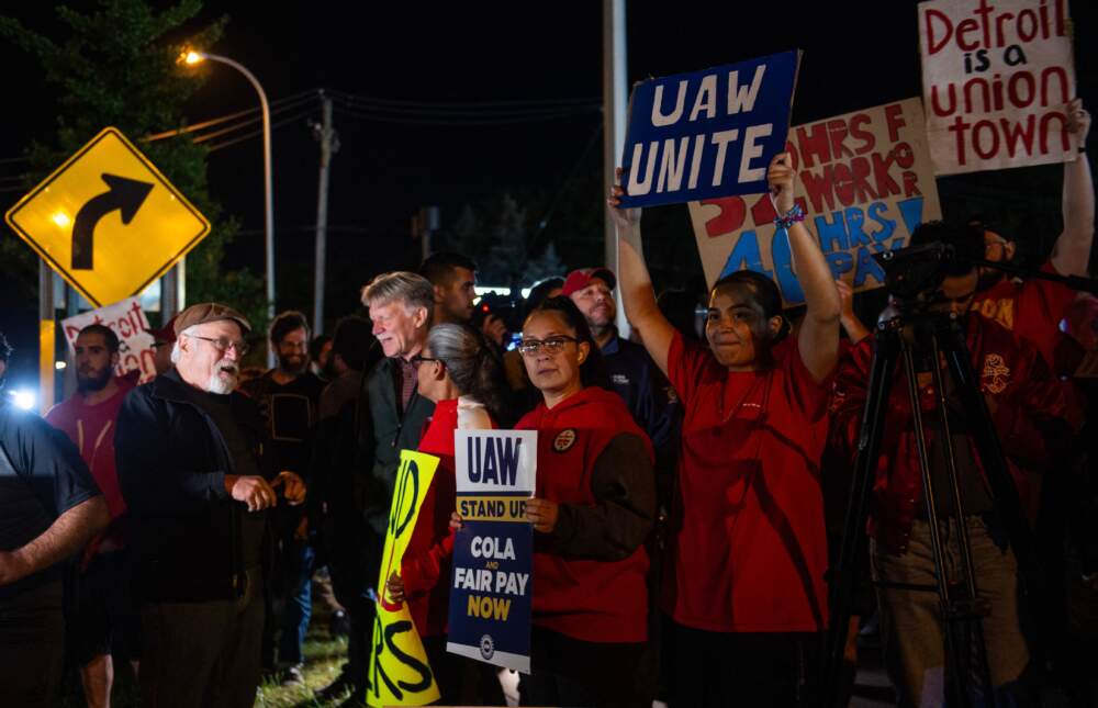 Members of the UAW (United Auto Workers) picket and hold signs outside of the UAW Local 900 headquarters across the street from the Ford Assembly Plant in Wayne, Michigan on Sept. 15, 2023. The US auto workers' union announced the start of a strike at three factories just after midnight on Friday, September 15, as a deadline expired to reach a deal with employers on a new contract. (Matthew Hatcher/AFP via Getty Images)