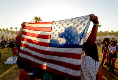 Festival-goers display the American Flag during Stagecoach: California's Country Music Festival. (Matt Cowan/Getty Images for Stagecoach)